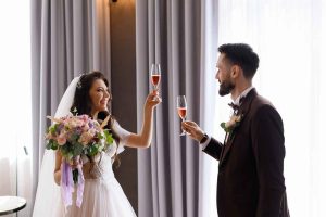 brides-celebrating-wedding-day-with-champagne